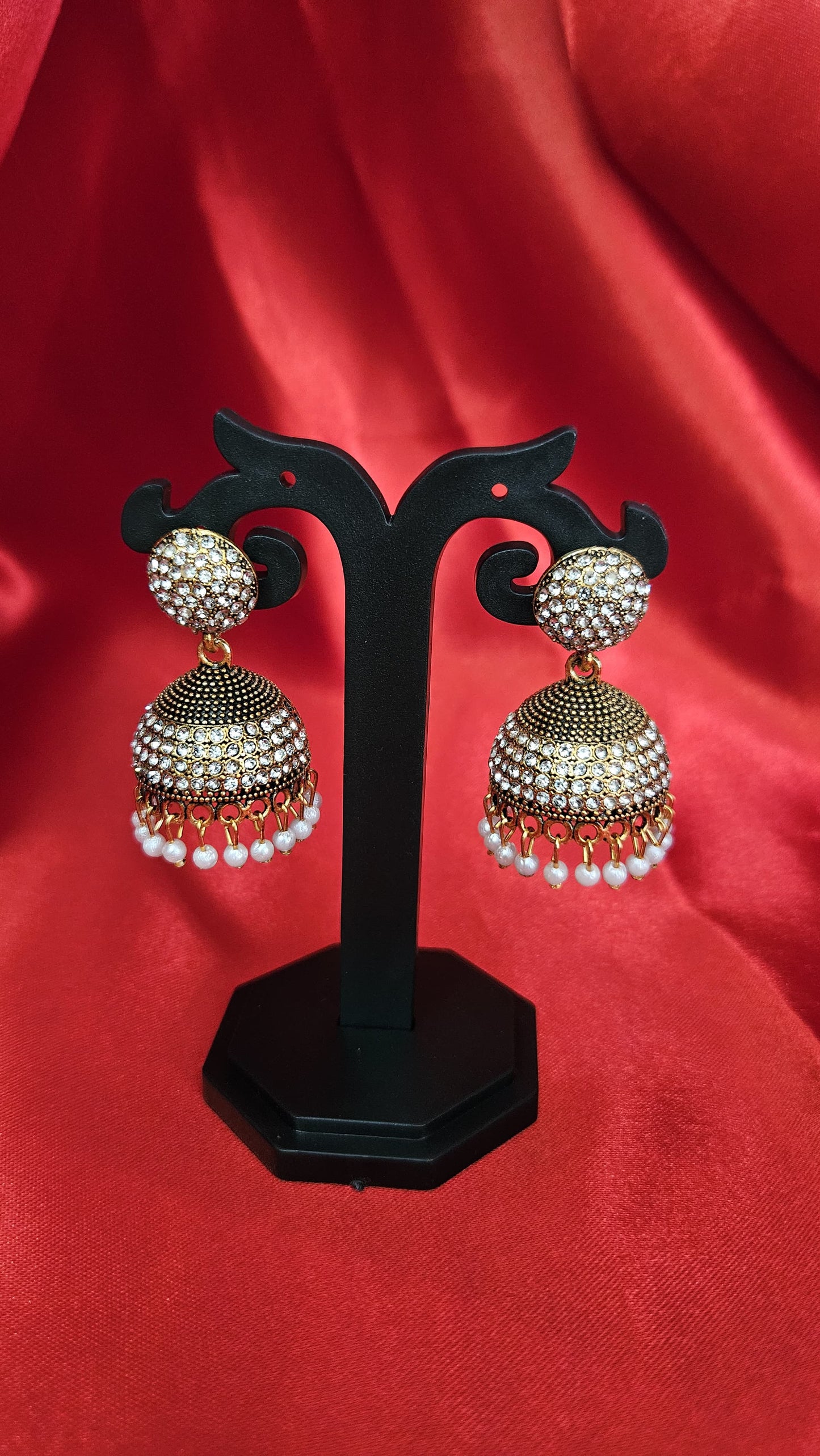 Elegant Stone-Studded Jhumka Earrings with Pearl Drops – Antique Gold Finish