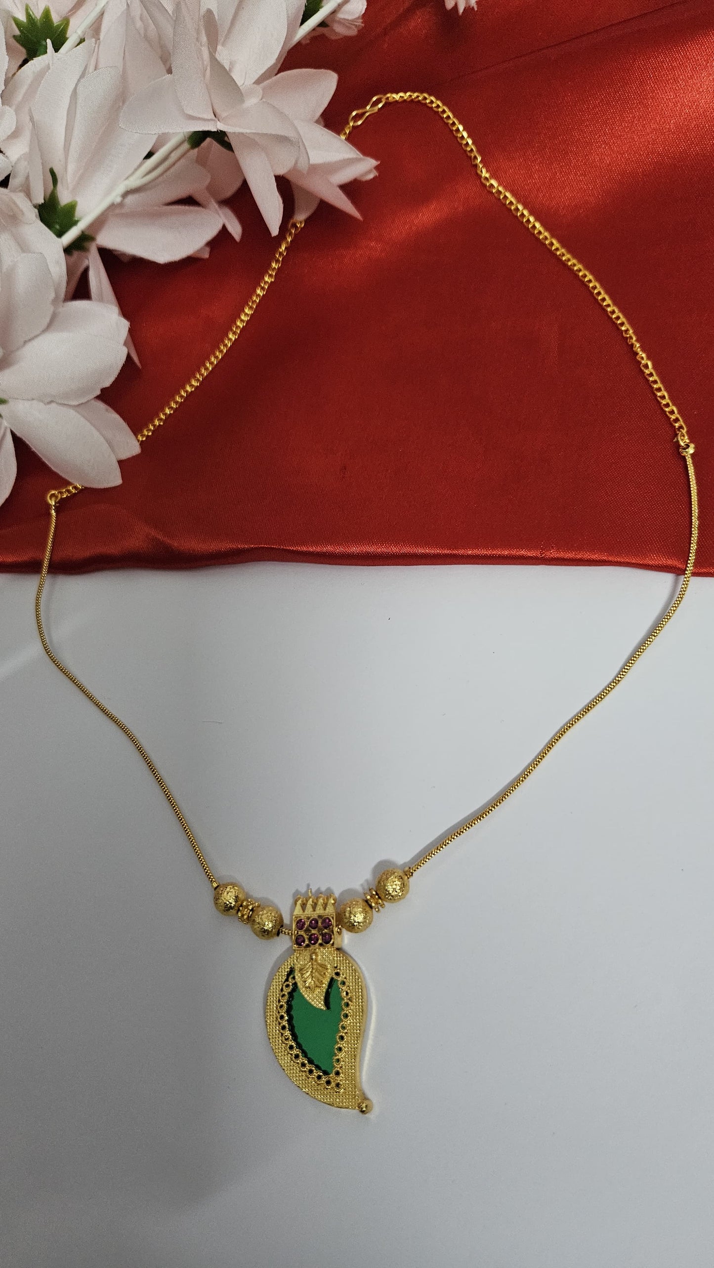 Elegant Gold-Toned Palakka Pendant Necklace with Paisley Design