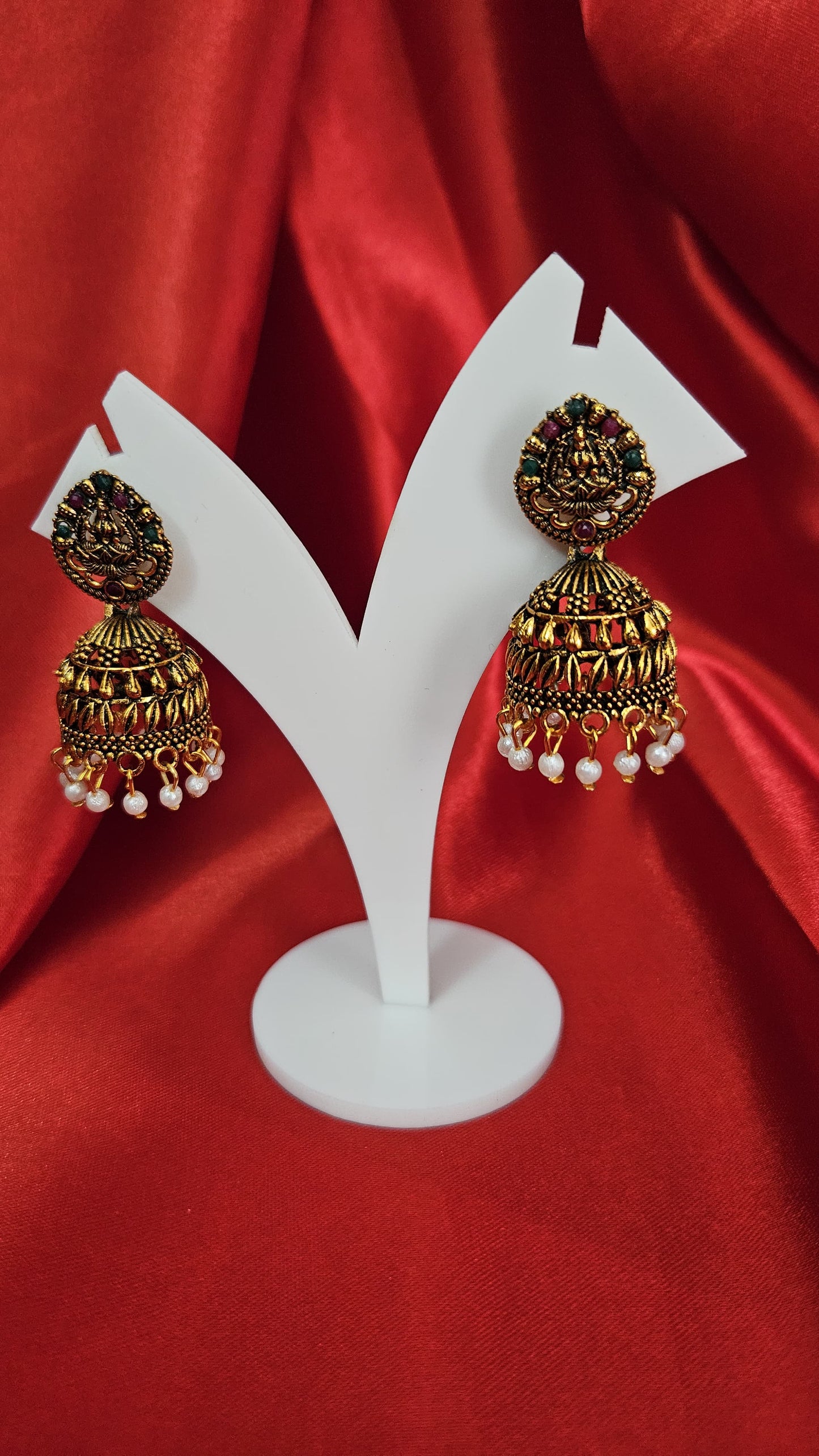 Traditional Temple Design Gold-Toned Jhumka Earrings with Red and Blue Stones